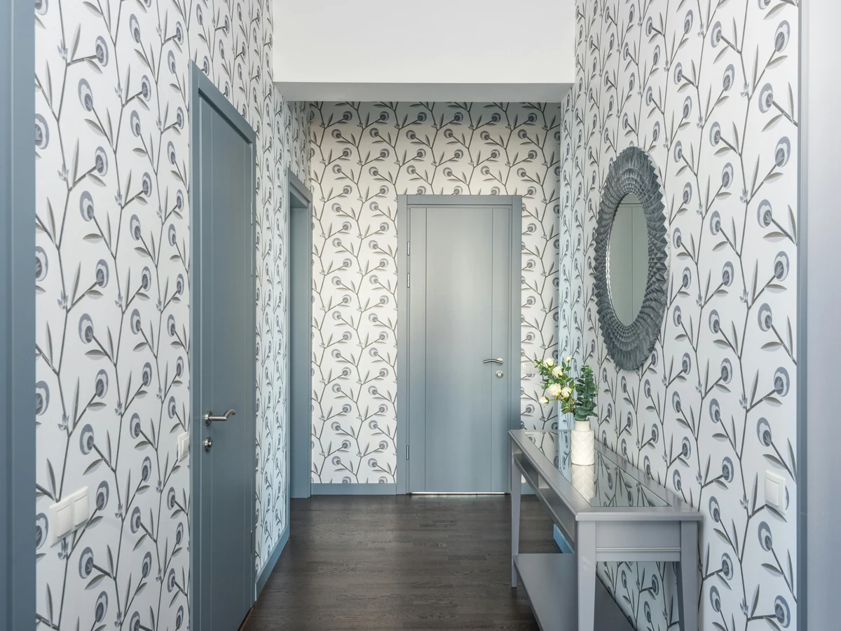 Hallway painted with bird pattern wallpaper by Hull Decorators in Hessle