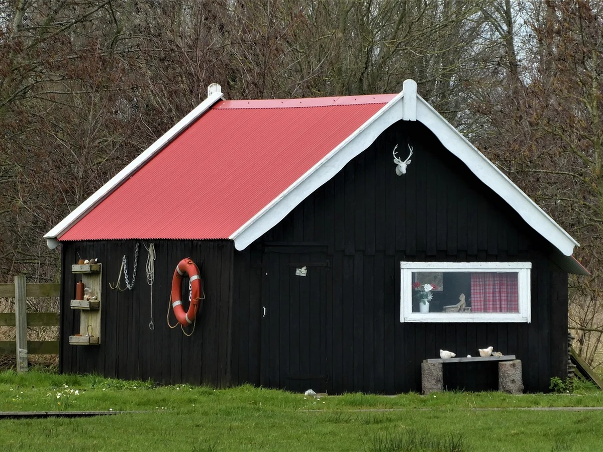 Black painted wooden outbuilding exterior by Hull Decorators, timber surface preparation and painting